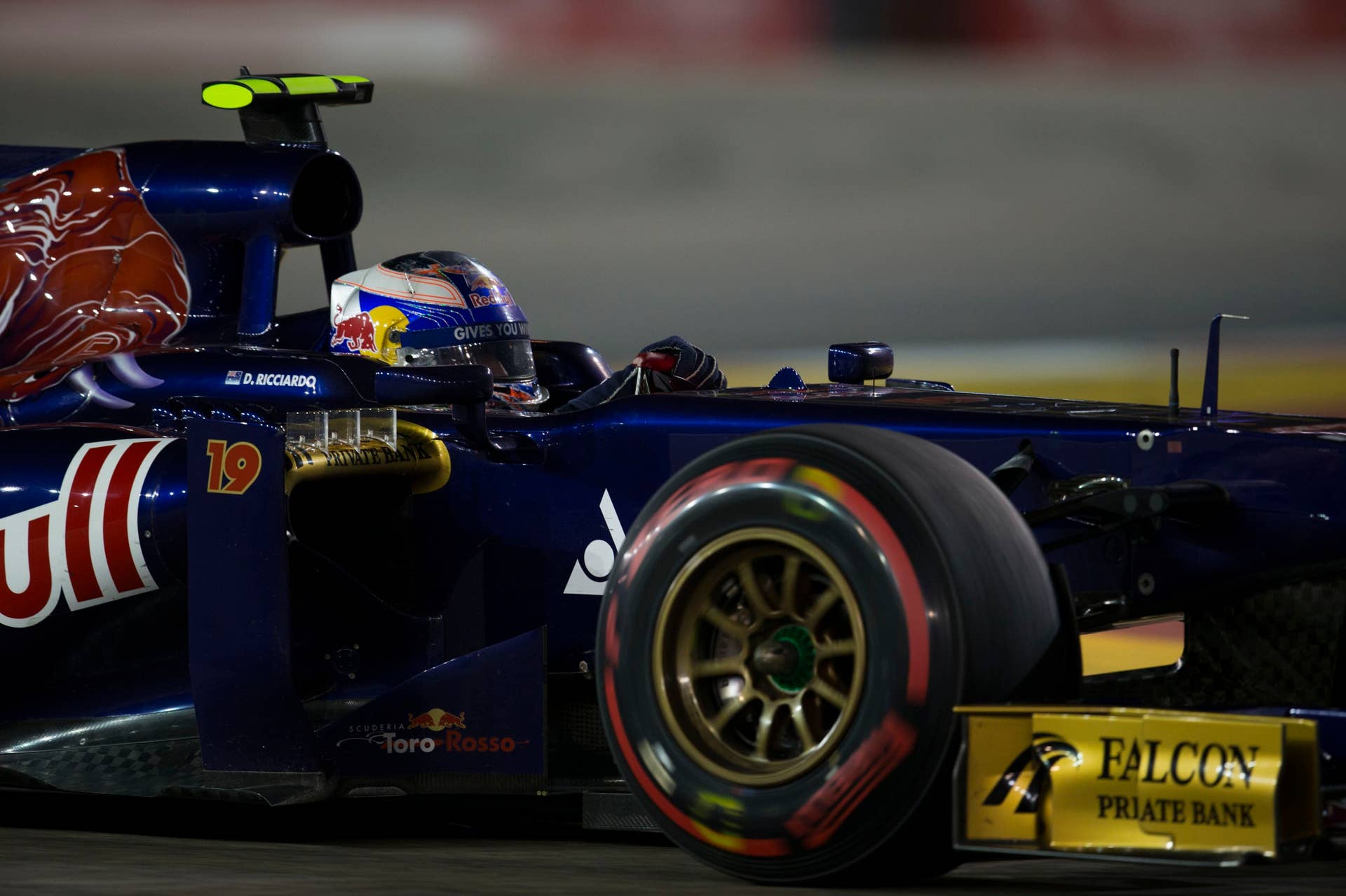 SINGAPORE - SEPTEMBER 22:  Daniel Ricciardo of Australia and Scuderia Toro Rosso drives during the Singapore Formula One Grand Prix at Marina Bay Street Circuit on September 22, 2013 in Singapore, Singapore.  (Photo by Peter Fox/Getty Images)