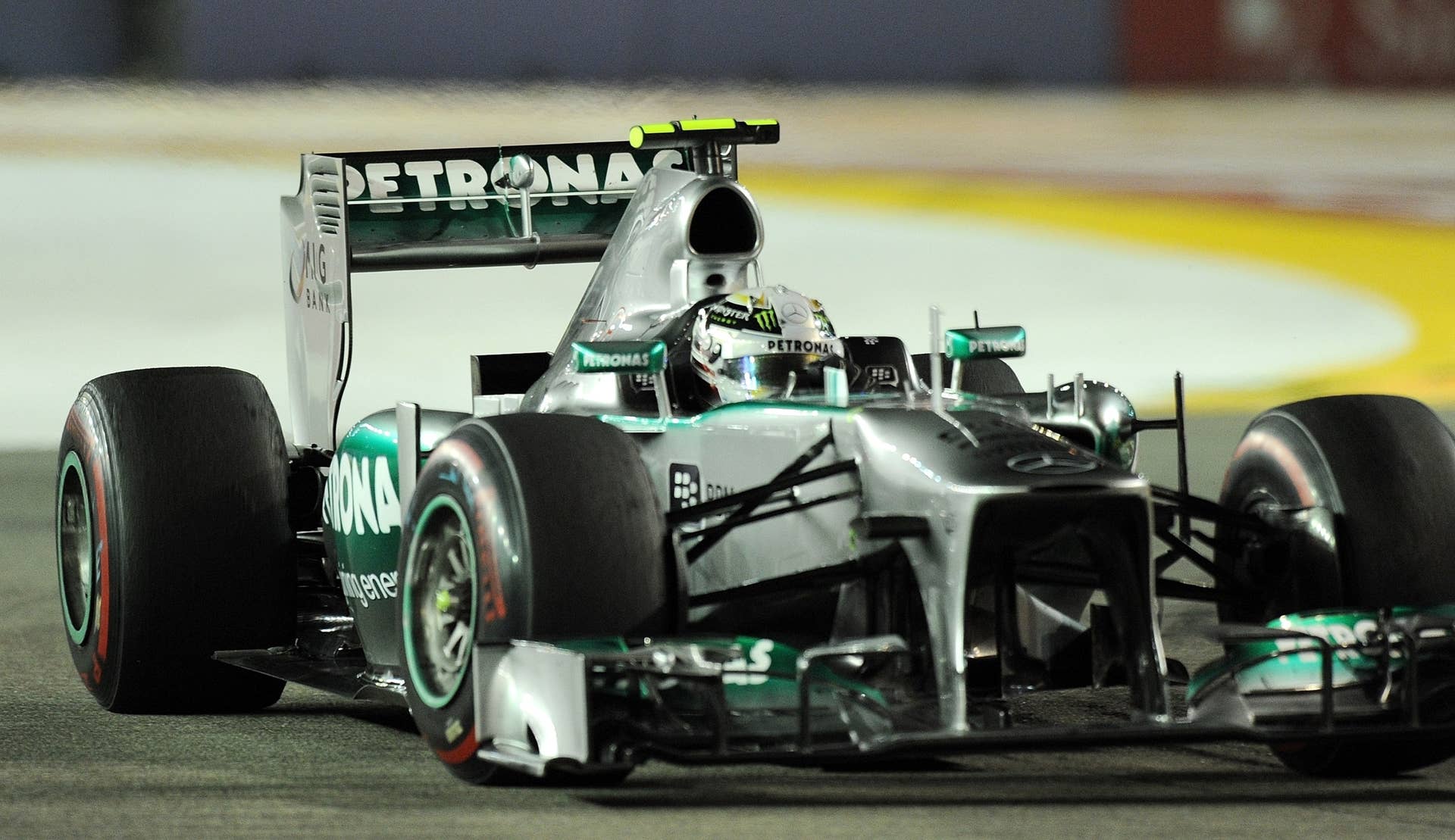 Mercedes driver Lewis Hamilton of Britain powers his car during the Formula One Singapore Grand Prix on September 22, 2013.   AFP PHOTO /  MANAN VATSYAYANA        (Photo credit should read MANAN VATSYAYANA/AFP/Getty Images)