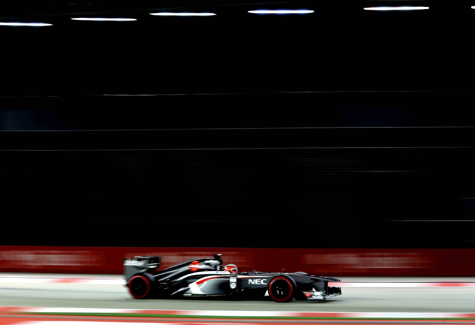 SINGAPORE - SEPTEMBER 21:  ANico Hulkenberg of Germany and Sauber F1 drives during qualifying for the Singapore Formula One Grand Prix at Marina Bay Street Circuit on September 21, 2013 in Singapore, Singapore.  (Photo by Mark Thompson/Getty Images)