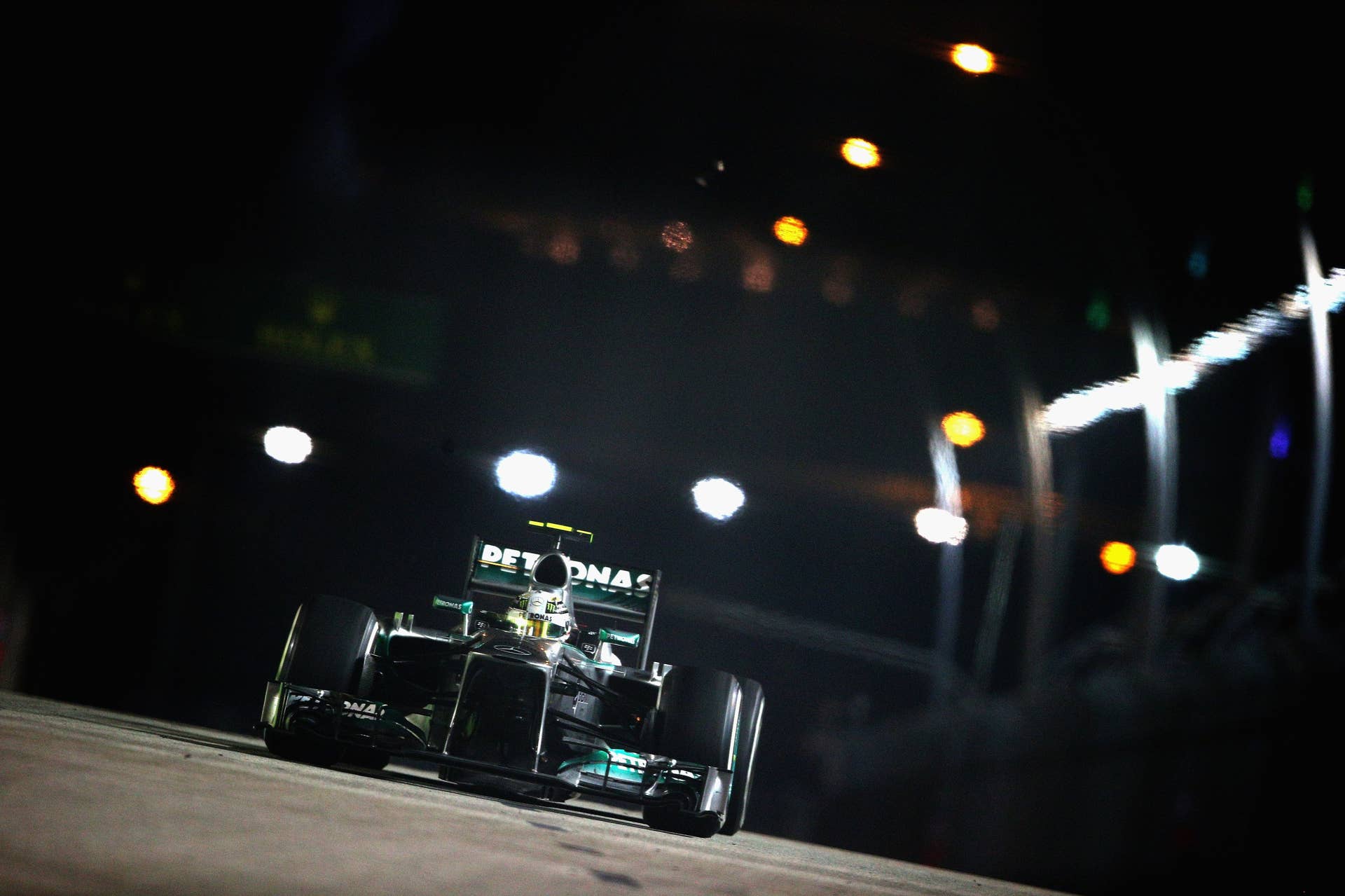 SINGAPORE - SEPTEMBER 22:  Lewis Hamilton of Geat Britain and Mercedes GP drives during the Singapore Formula One Grand Prix at Marina Bay Street Circuit on September 22, 2013 in Singapore, Singapore.  (Photo by Clive Mason/Getty Images)