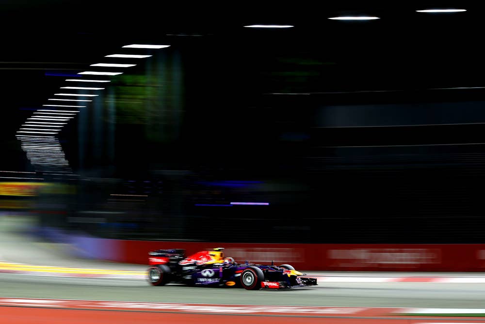 SINGAPORE - SEPTEMBER 21:  Mark Webber of Australia and Infiniti Red Bull drives during qualifying for the Singapore Formula One Grand Prix at Marina Bay Street Circuit on September 21, 2013 in Singapore, Singapore.  (Photo by Mark Thompson/Getty Images)