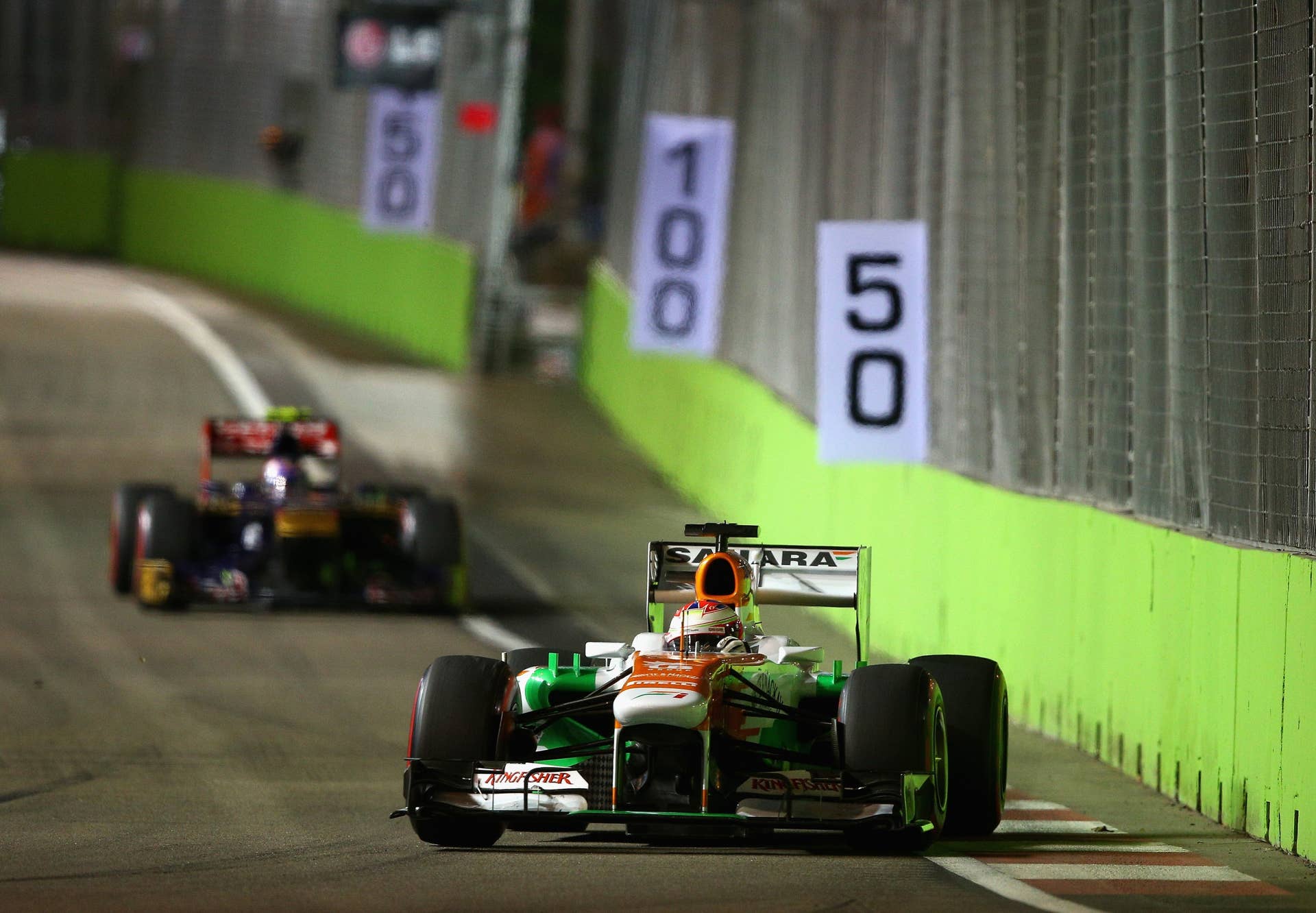 SINGAPORE - SEPTEMBER 22: Paul di Resta of Great Britain and Force India drives during the Singapore Formula One Grand Prix at Marina Bay Street Circuit on September 22, 2013 in Singapore, Singapore.
