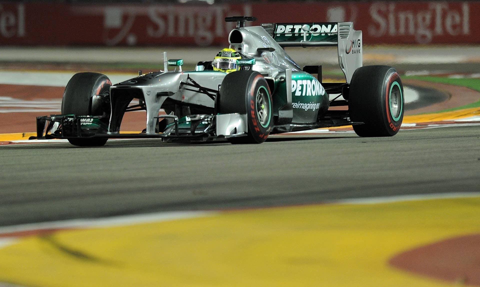 Mercedes driver Nico Rosberg of Germany powers his car during the Formula One Singapore Grand Prix on September 22, 2013.   AFP PHOTO /  MANAN VATSYAYANA        (Photo credit should read MANAN VATSYAYANA/AFP/Getty Images)