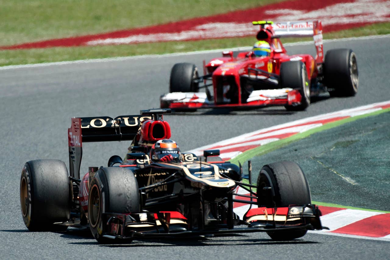 (L to R) Lotus F1 Team's Finnish driver Kimi Raikkonen and Ferrari's Brazilian driver Felipe Massa drive at the Circuit de Catalunya in Montmelo near Barcelona on May 12, 2013 during the Spanish Formula One Grand Prix. AFP PHOTO / TOM GANDOLFINITom Gandolfini/AFP/Getty Images