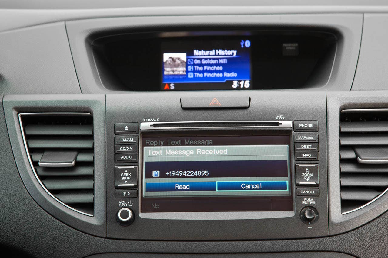 2012 Honda CR-V EX-L AWD interior with available Honda Satellite-Linked Navigation System (SMS text function shown)