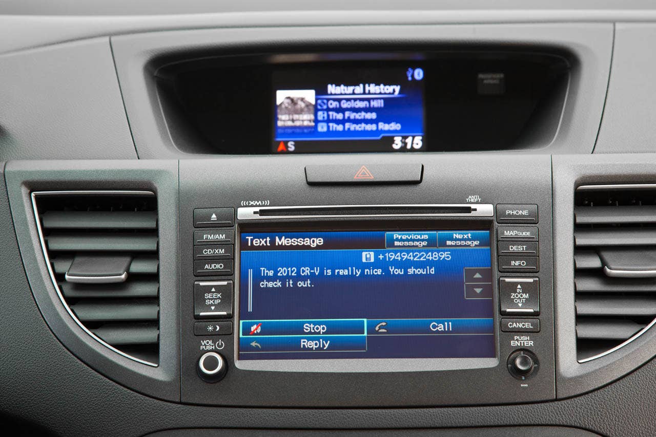 2012 Honda CR-V EX-L AWD interior with available Honda Satellite-Linked Navigation System (SMS text function shown)