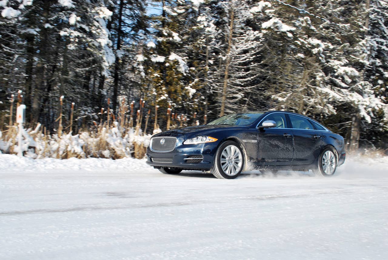 2013 Jaguar XJ AWD front 3/4 view snow driving