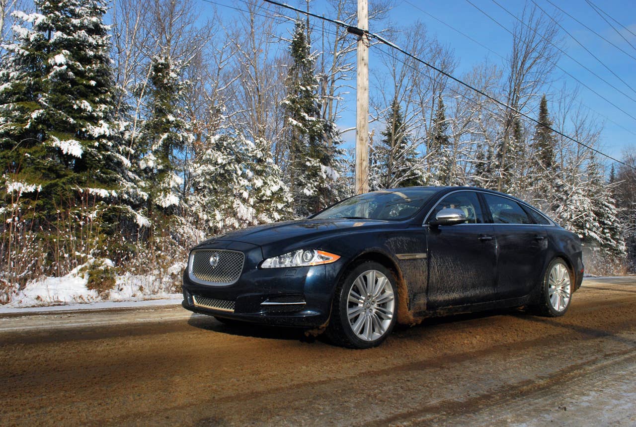 2013 Jaguar XJ AWD front 3/4 view dirt driving
