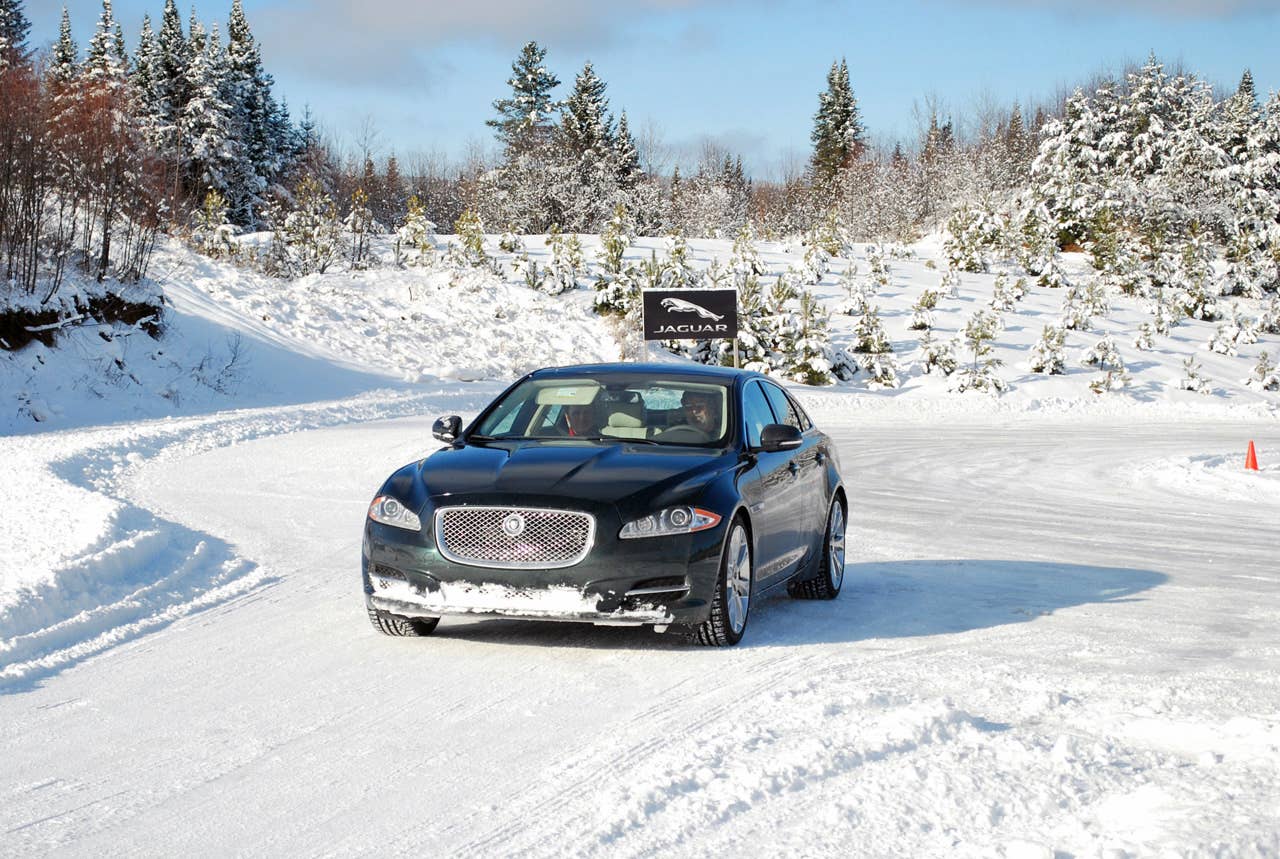 2013 Jaguar XJ AWD front 3/4 view driving