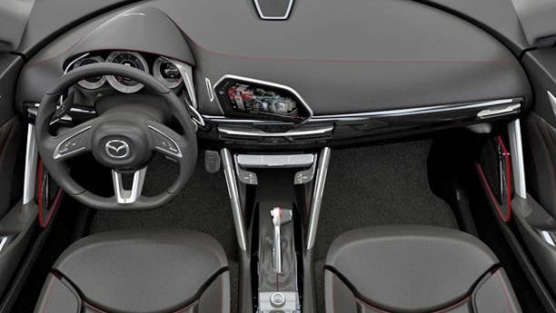 The Mazda Minagi's interior might not look like anything revolutionary, but that's a good thing. Mazda has always built driver-centric machines and when it comes to this crossover concept, the person behind the wheel is at the center of it all. The instrument panel is comprised of three rings to keep tabs on engine vitals and display navigation instructions, while a center-mounted LCD is canted towards the driver and allows them to control the Minagi's infotainment features. If you're considering a Mazda in the future, take note: this interior will be the inspiration for its next generation of vehicles.