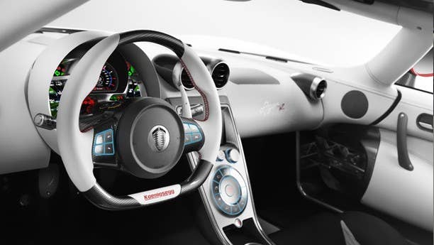 The Koenigsegg Agera isn't a concept, it's the successor to the company's original world-beating supercar, the CCX. The Agera packs a 1,115-horsepower twin-turbocharged V8 that can run to 124 mph in 7.5 seconds, but more impressive than the performance is the bespoke interior. K-egg hypes the quality of materials– specifically the aluminum, carbon fiber, alcantara and aniline leather – but the trick switchgear, billet aluminum buttons and LEDs are a sight to behold. Configurable instruments are part of the multi-million dollar package, with the CAN-bus system being controlled through a stalk on the steering wheel to display a range of information to suit the driving environment. On the track? Dial up the rev-counter, lap timer and G-force indicator. Back on the road? Connect your Bluetooth equipped phone, play some tunes and let the computer handle the shifting.