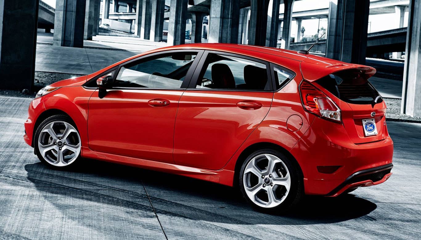 Sticker Price: $21,400  ?Invoice Price: NA  As Tested Price: $24,785  ??Engine: Turbocharged 1.6-liter I4  ??Transmission: Six-speed manual  ??Performance: 197 horsepower, 202 lb-ft of torque, 0-60 mph in 6.9 seconds   ??Fuel Economy: 26 mpg city, 35 mpg highway??  Seating: Five people??  Cargo Capacity: 26.0 cubic feet  Research the Ford Fiesta ST Ford Fiesta ST Overview Ford Fiesta ST Photos & Video Ford Fiesta ST Local Dealer Price Quote