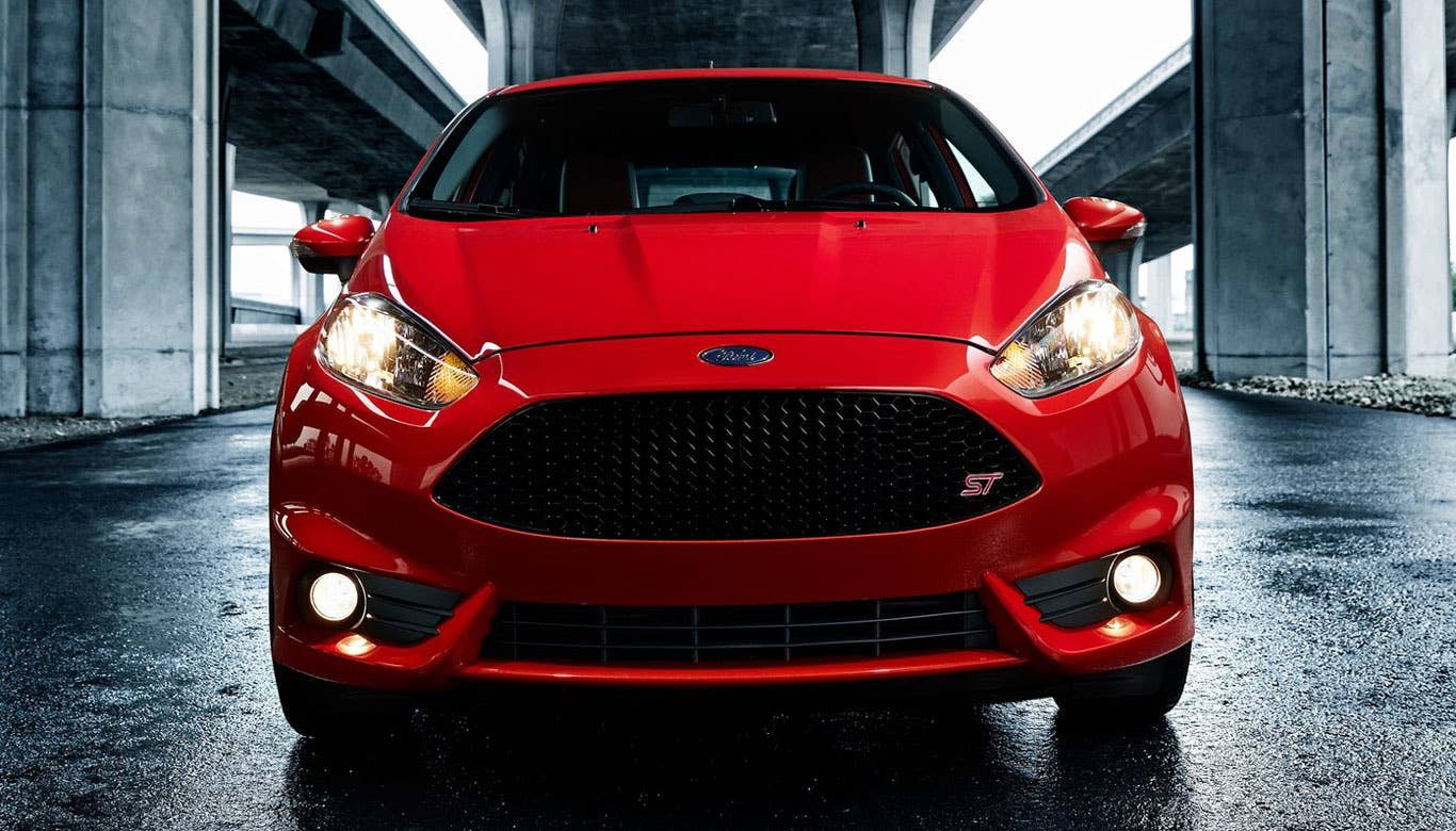 The entire Fiesta line, including the sedan, hatchback and ST, received a facelift for the 2014 model year. The big changes are on the front fascia, where a new grille and slimmer, more aggressive headlights are now featured. The rear fascia was also slightly changed.  There are a few visual cues that separate the ST from the standard Fiesta. These include a lower ride height and different lower body work, a rear spoiler, chrome-tipped exhaust pipes, bigger wheels and a rear diffuser.  The Fiesta ST looks great. It still retains the cuteness of the standard little hatchback, but with some added aggression and sportiness. The tweaks aren't overdone, keeping the car firmly in line with its roots, but are obvious enough to let people know that the ST is a subcompact that means business.  Research the Ford Fiesta ST Ford Fiesta ST Overview Ford Fiesta ST Photos & Video Ford Fiesta ST Local Dealer Price Quote