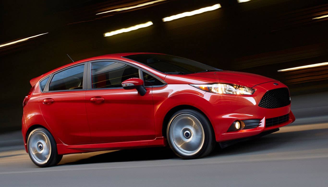 On paper, the Fiesta ST doesn't look like the beast it truly is. It's equipped with front-wheel drive and a small 1.6L engine that produces 197 hp and 202 lb-ft of torque. Plus, Ford isn't generally known for its handling dynamics like, say, BMW.  But, boy, get behind the wheel of this little rocket and mash the gas pedal, and you're treated to a brilliantly engineered, featherweight machine that sticks to the road like peanut butter on bread.  The wonderful driving dynamics of the ST are the result of a combination of several attributes done just right. Its light weight (2,564 lbs), potent engine that grants power at nearly any RPM level and lovely gearbox that allows for quick, crisp shifts makes for fast, thrilling acceleration. The lowered ride height, larger wheels, sticky tires and weighted steering makes it remarkably nimble around corners. And its new disc brakes allow the driver to slow down on a dime.  All in all, driving this car is a wonderfully fun experience. In fact, I think the lighter Fiesta ST is even more enjoyable than its big brother, the Focus ST, which is a great car in its own right. The designers and engineers at Ford have a real winner on their hands.  Research the Ford Fiesta ST Ford Fiesta ST Overview Ford Fiesta ST Photos & Video Ford Fiesta ST Local Dealer Price Quote