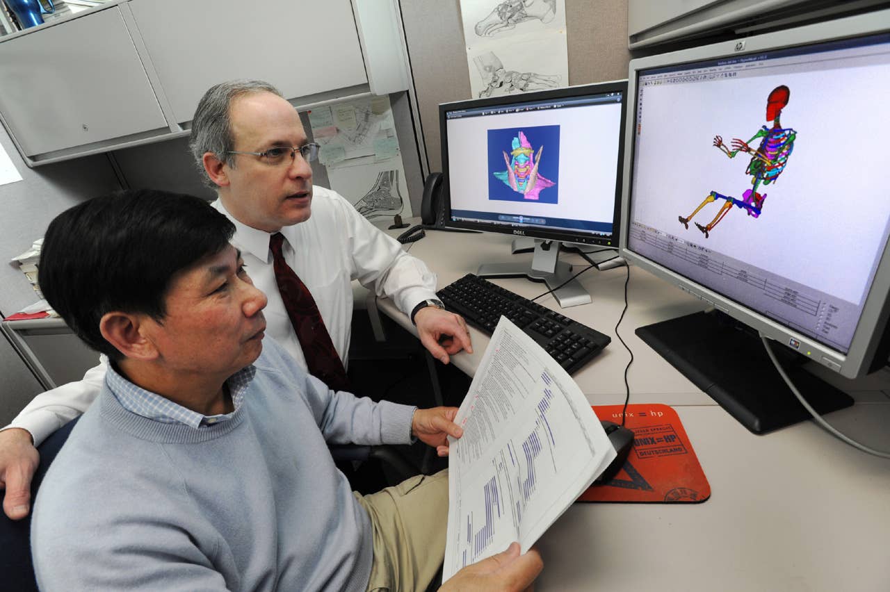 Steve Rouhana works on Ford's adult digital human model with researcher Jesse Ruan. Rouhana is the Senior Technical Leader for Safety, Ford Research and Advanced Engineering. (03/31/2011)