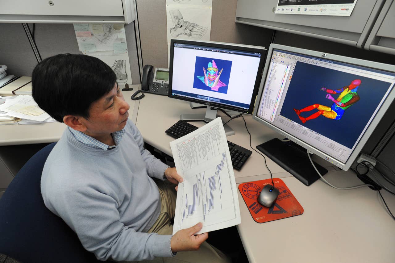 Biomechanics researcher Jesse Ruan studies the movement of an adult digital model. The models, with body parts and organs replicated, took more than a decade to create. (03/31/2011)