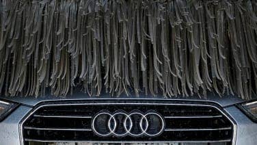 Write the words 'wash me' on the very dirty surface of the car. Concept car wash.