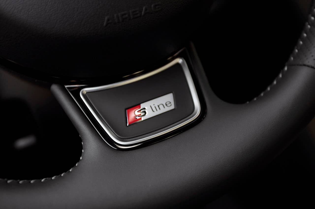 2012 Audi Q3 steering wheel badge