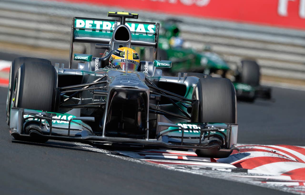 Mercedes driver Lewis Hamilton of Britain drives his race car during the Formula One Hungarian Grand Prix at the Hungaroring racetrack, near Budapest, Hungary, Sunday, July 28, 2013. Hamilton won the race. (AP Photo/Bela Szandelszky)