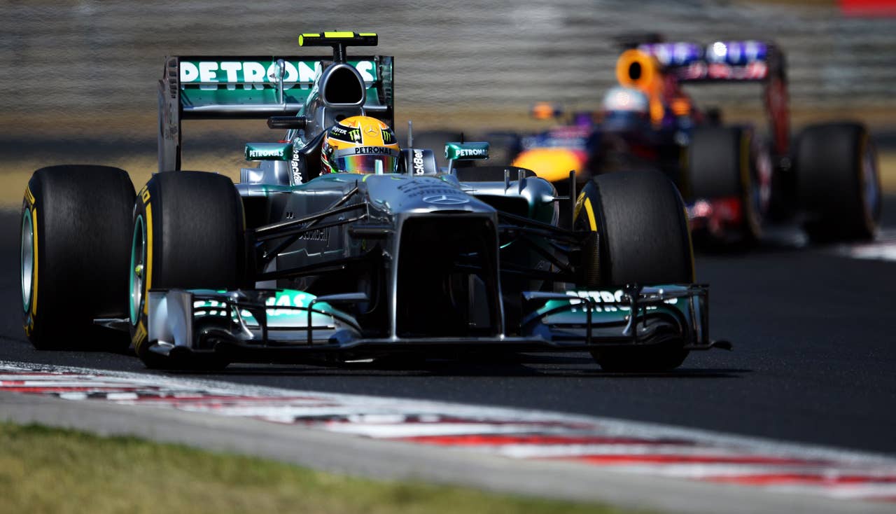 BUDAPEST, HUNGARY - JULY 28:  Lewis Hamilton of Great Britain and Mercedes GP leads from Sebastian Vettel of Germany and Infiniti Red Bull Racing during the Hungarian Formula One Grand Prix at Hungaroring on July 28, 2013 in Budapest, Hungary.  (Photo by Lars Baron/Getty Images)