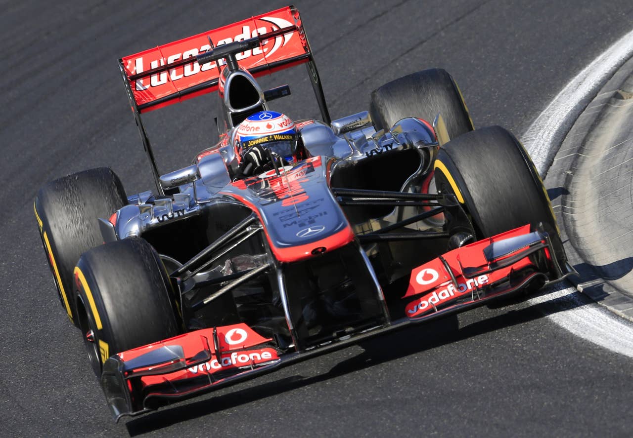 McLaren Mercedes' British driver Jenson Button drives at the Hungaroring circuit in Budapest on July 28, 2013 during the Hungarian Formula One Grand Prix. AFP PHOTO / ALEXANDER KLEINALEXANDER KLEIN/AFP/Getty Images