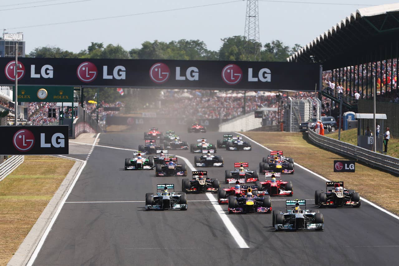 BUDAPEST, HUNGARY - JULY 28: Lewis Hamilton of Great Britain and Mercedes GP leads the field towards the first corner at the start of the Hungarian Formula One Grand Prix at Hungaroring on July 28, 2013 in Budapest, Hungary. (Photo by Mark Thompson/Getty Images)