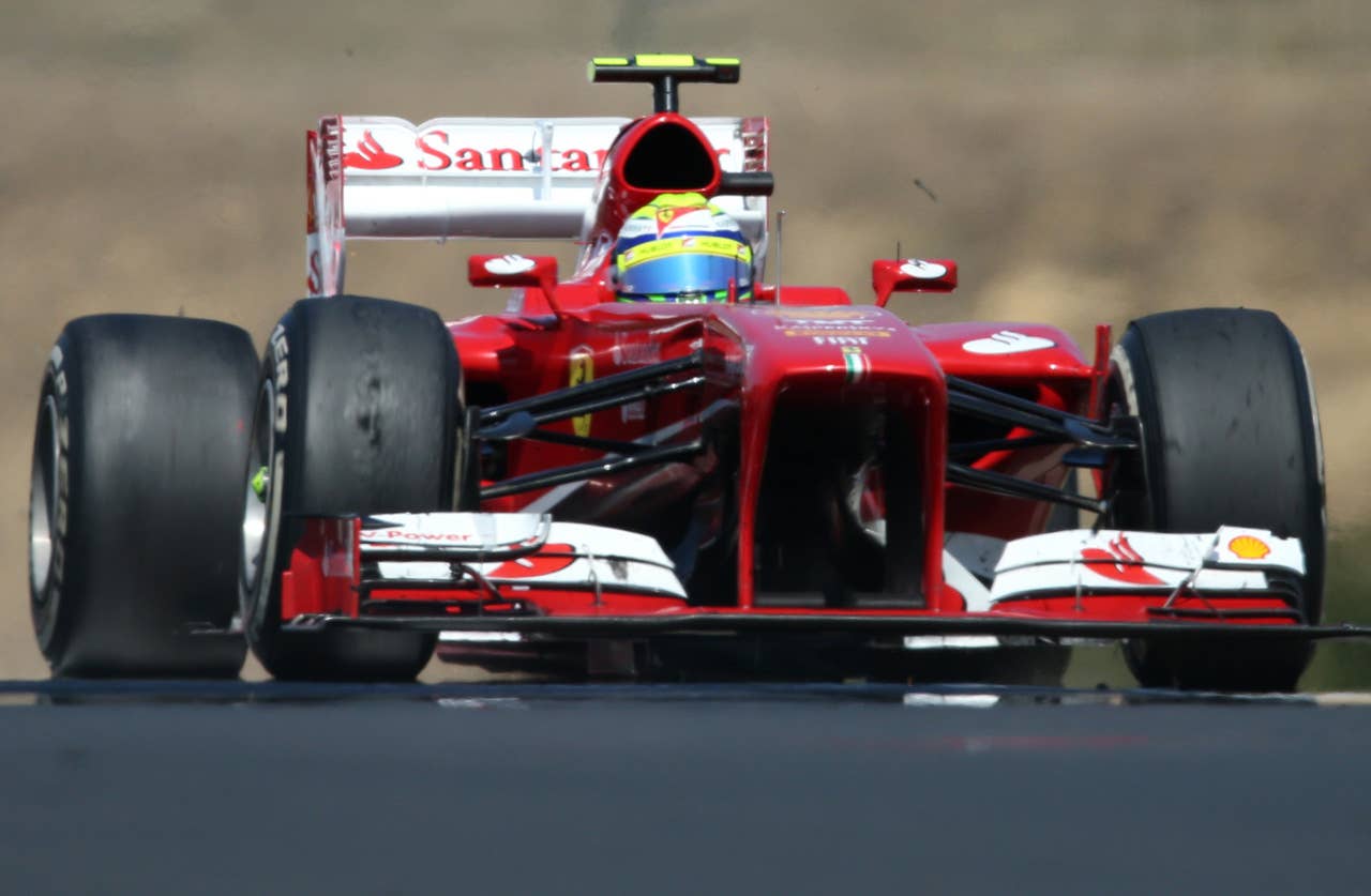Ferrari's Brazilian driver Felipe Massa  drives at the Hungaroring circuit in Budapest on July 28, 2013 during the Hungarian Formula One Grand Prix.     AFP PHOTO / FERENC ISZAFERENC ISZA/AFP/Getty Images