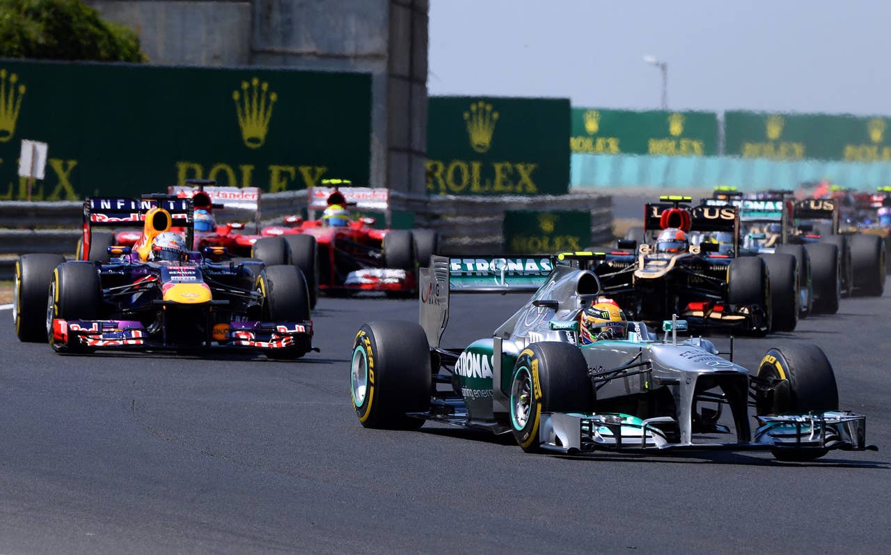 Mercedes'  British driver Lewis Hamilton leads after the start at the Hungaroring circuit in Budapest on July 28, 2013 during the Hungarian Formula One Grand Prix.    AFP PHOTO / ATTILA KISBENEDEKATTILA KISBENEDEK/AFP/Getty Images