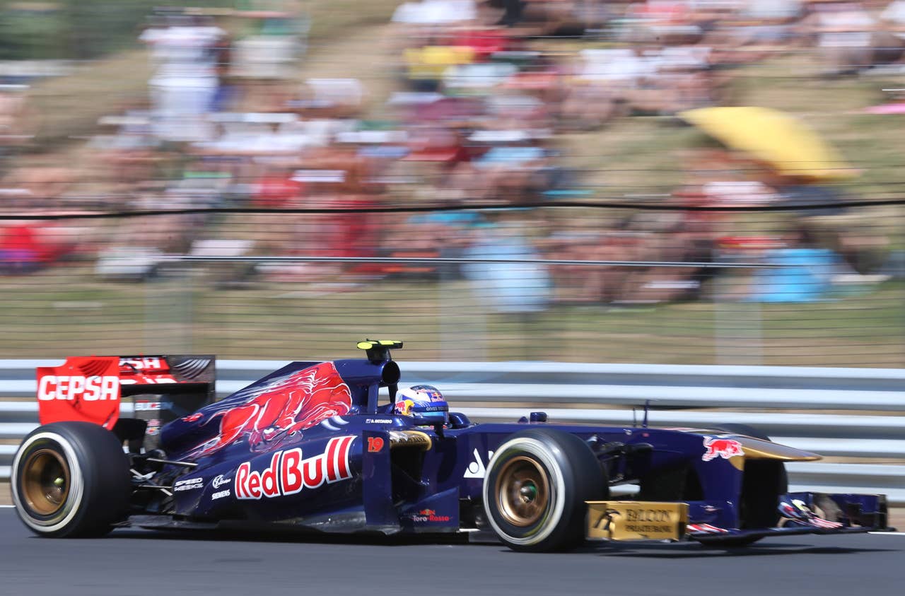 Scuderia Toro Rosso's Australian driver Daniel Ricciardo drives at the Hungaroring circuit in Budapest on July 28, 2013 during the Hungarian Formula One Grand Prix.     AFP PHOTO / FERENC ISZAFERENC ISZA/AFP/Getty Images