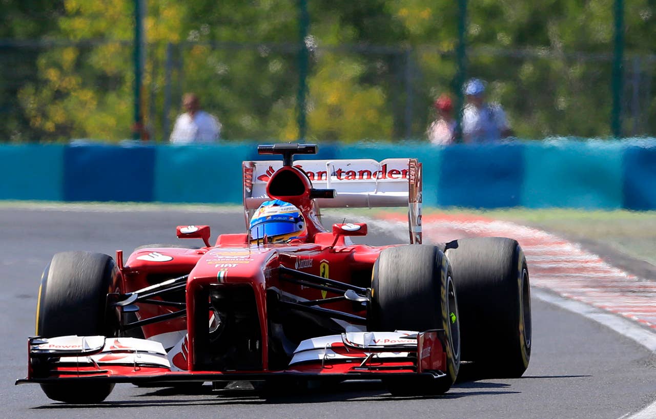 Ferrari's Spanish driver Fernando Alonso  drives at the Hungaroring circuit in Budapest on July 28, 2013 during the Hungarian Formula One Grand Prix. AFP PHOTO / ALEXANDER KLEINALEXANDER KLEIN/AFP/Getty Images