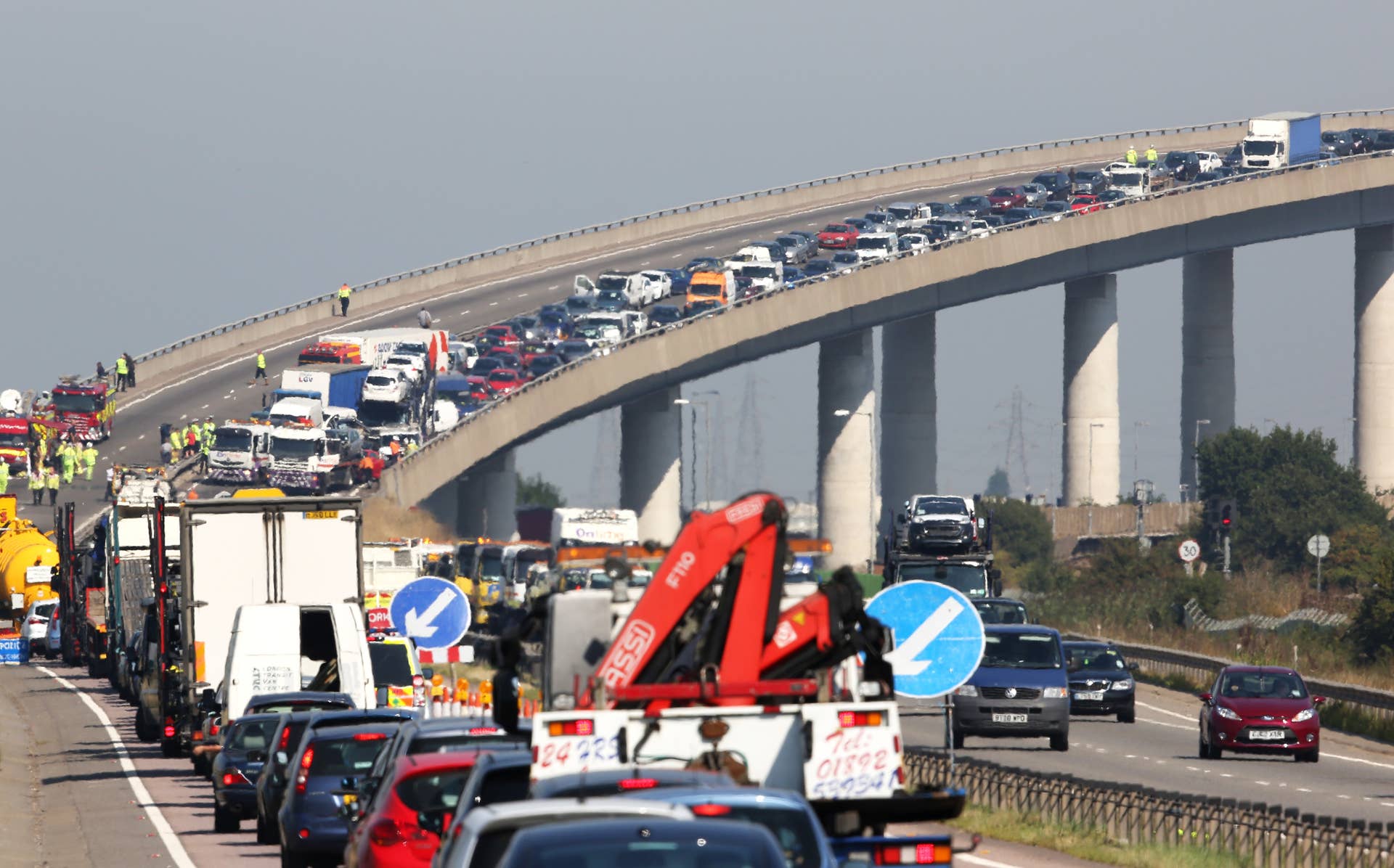 ISLE OF SHEPPEY, KENT - SEPTEMBER 05: A general view of the site of a major traffic accident on the A249 Sheppey crossing bridge in Kent on September 5, 2013 in Isle of Sheppey, Kent. Over 130 vehicles were involved in the series of accidents, with thick fog blamed for poor visibility. The crash occurred around 07:15AM BST, with at least 8 people suffering serious injuries, and approximately 60 people treated for minor injuries. (Photo by Peter Macdiarmid/Getty Images)