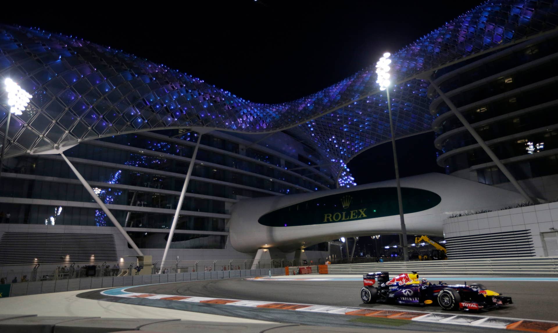 Red Bull driver Sebastian Vettel of Germany leads during the Abu Dhabi Formula One Grand Prix at the Yas Marina racetrack in Abu Dhabi, United Arab Emirates, Sunday, Nov. 3, 2013. (AP Photo/Luca Bruno)