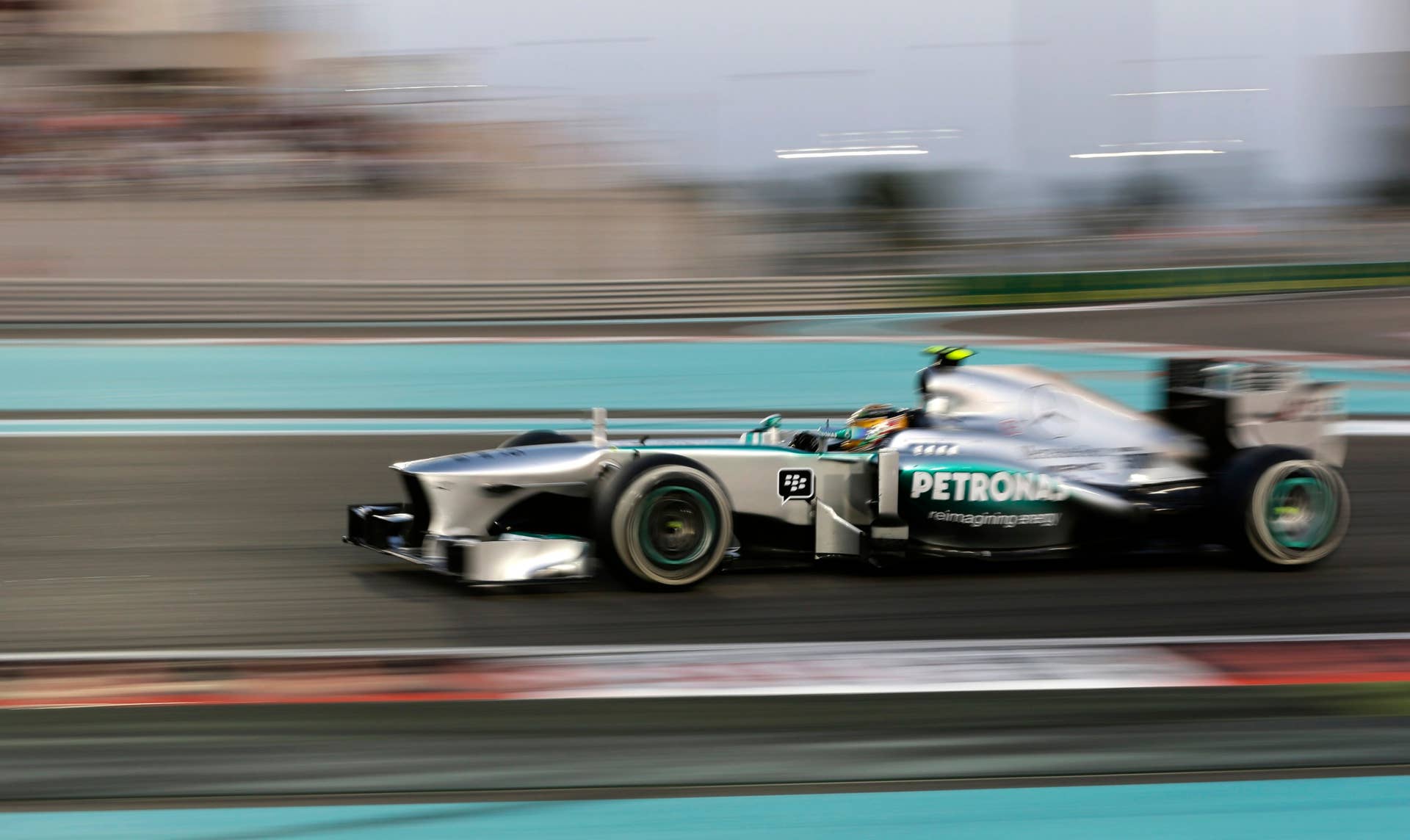 Mercedes driver Lewis Hamilton of Britain steers his car during the Emirates Formula One Grand Prix at the Yas Marina racetrack in Abu Dhabi, United Arab Emirates, Sunday, Nov. 3, 2013. (AP Photo/Hassan Ammar)