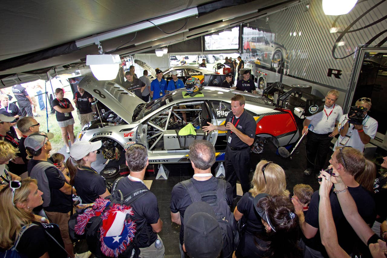 Cadillac Racing, SCCA Pro Racing World Challenge, Mid-Ohio Sports Car Course, Lexington, Ohio, August 5-7, 2011. Mark Kent, Director of GM Racing, explains how various systems and components in the CTS-V race car work (Richard Prince/Cadillac Racing Photo).