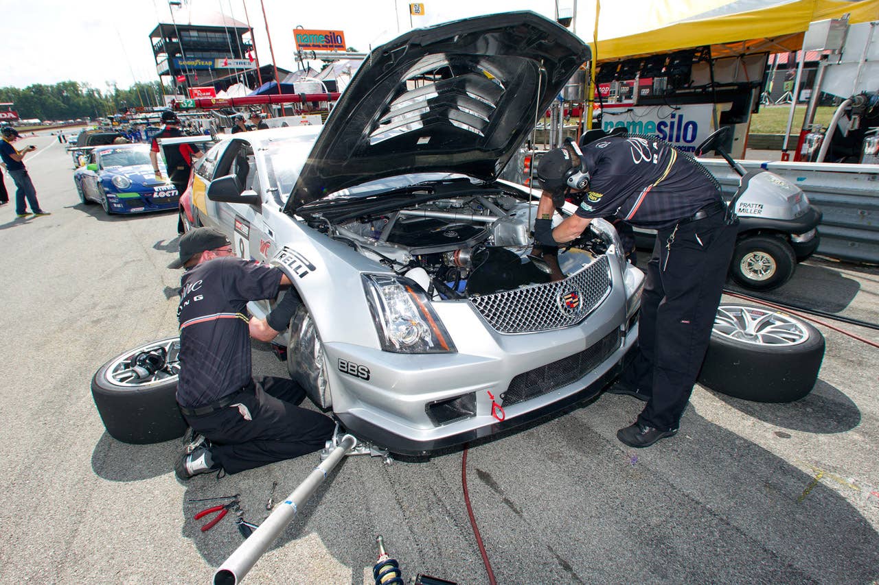 Cadillac Racing, SCCA Pro Racing World Challenge, Mid-Ohio Sports Car Course, Lexington, Ohio, August 5-7, 2011. The CTS-V Cadillac crew makes various adjustments to Andy Pilgrim's car during a practice session (Richard Prince/Cadillac Racing Photo).