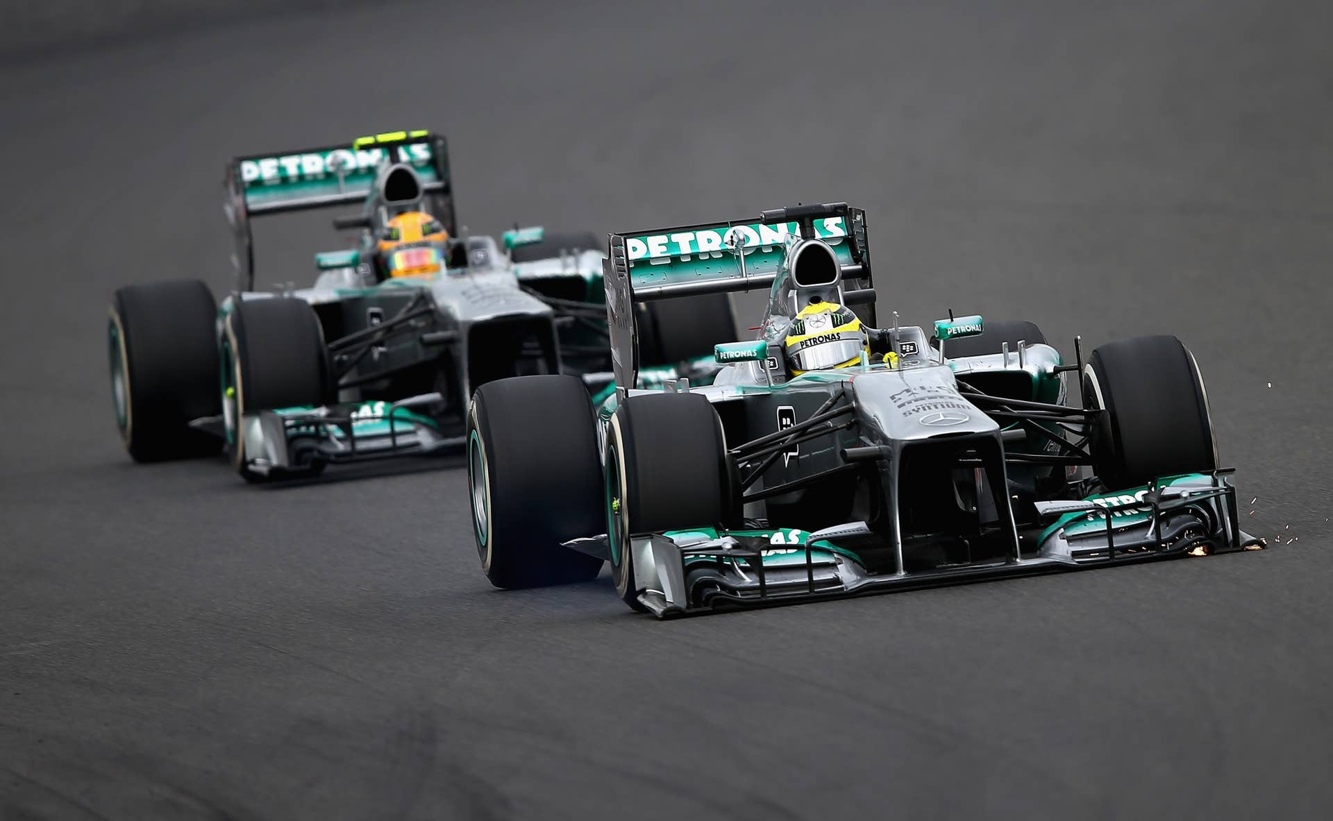 YEONGAM-GUN, SOUTH KOREA - OCTOBER 06:  Nico Rosberg of Germany and Mercedes GP leads from team mate Lewis Hamilton of Great Britain and Mercedes GP during the Korean Formula One Grand Prix at Korea International Circuit on October 6, 2013 in Yeongam-gun, South Korea.  (Photo by Clive Mason/Getty Images)