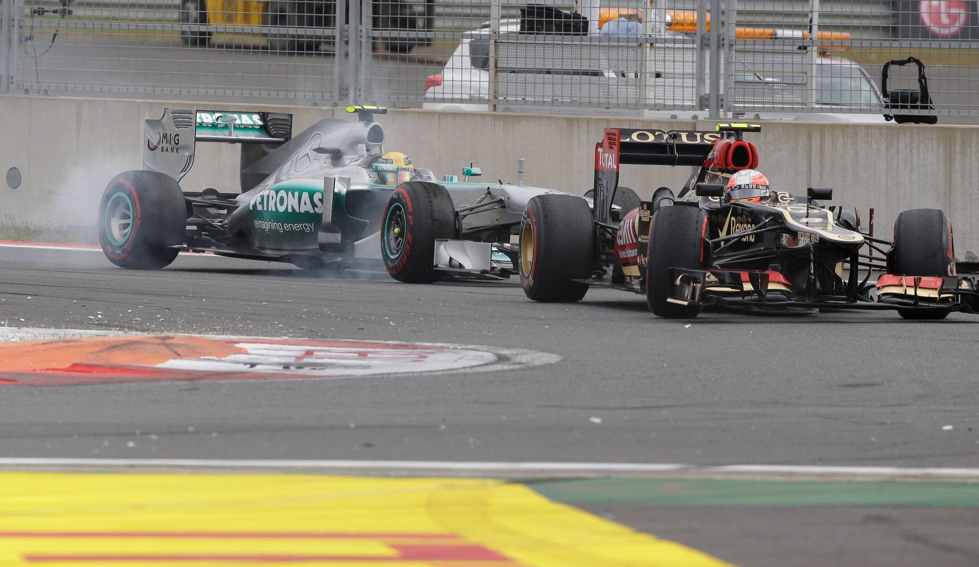 Lotus driver Romain Grosjean of France leads Mercedes driver Lewis Hamilton of Britain during the Korean Formula One Grand Prix at the Korean International Circuit in Yeongam, South Korea, Sunday, Oct. 6, 2013. (AP Photo/Lee Jin-man)