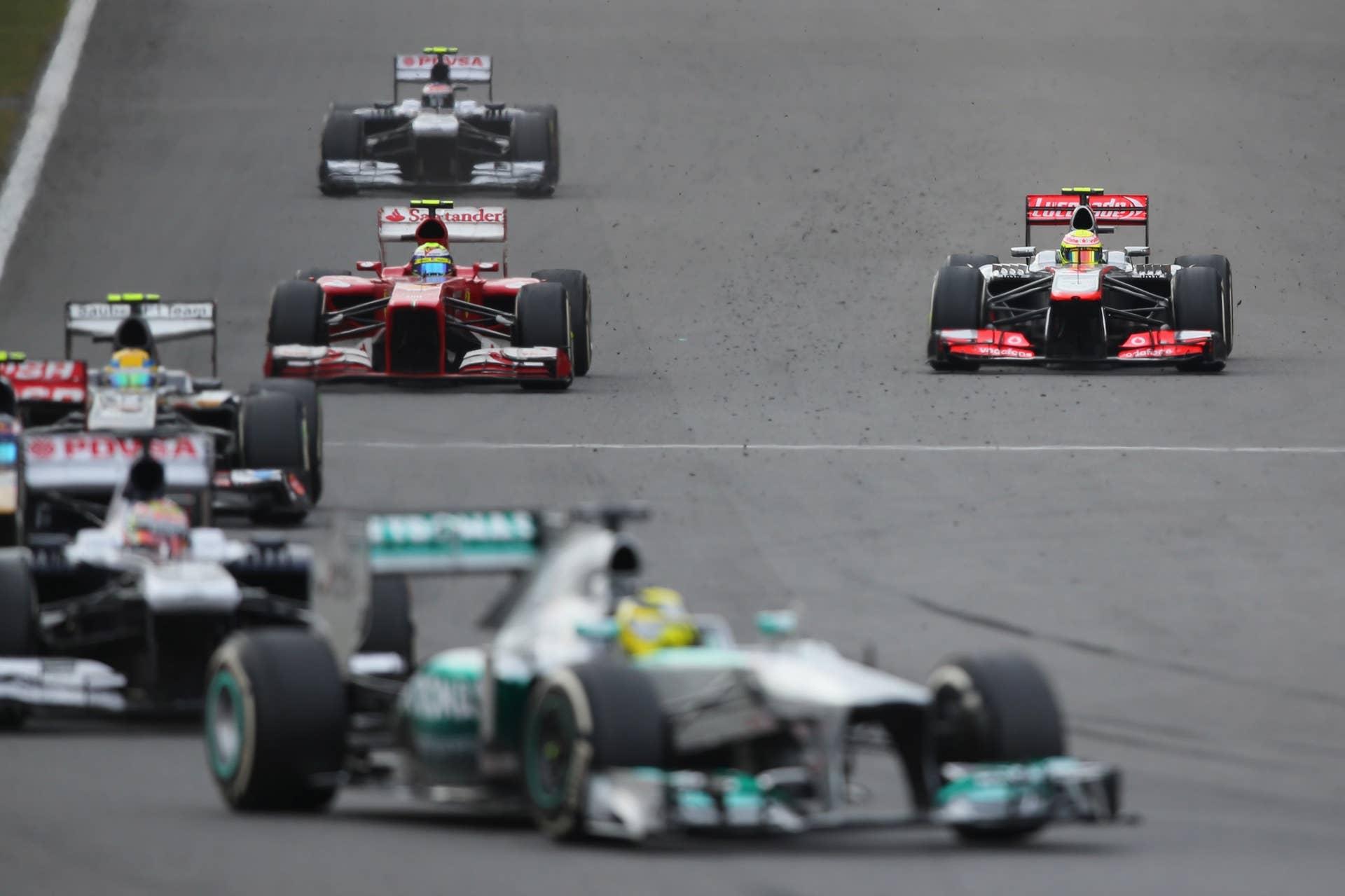 YEONGAM-GUN, SOUTH KOREA - OCTOBER 06:  Sergio Perez (R) of Mexico and McLaren suffers a tyre failure during the Korean Formula One Grand Prix at Korea International Circuit on October 6, 2013 in Yeongam-gun, South Korea.  (Photo by Clive Rose/Getty Images)