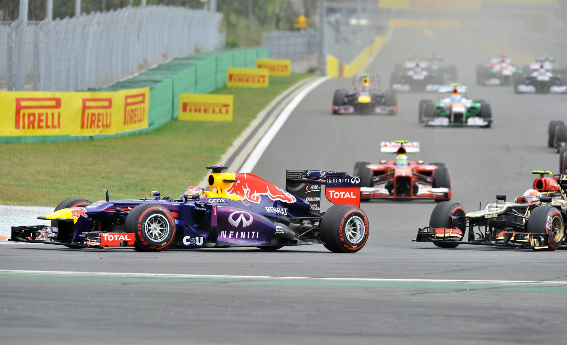Red Bull driver Sebastian Vettel of Germany (L) leads during the Formula One Korean Grand Prix in Yeongam on October 6, 2013.  AFP PHOTO / JUNG YEON-JE        (Photo credit should read JUNG YEON-JE/AFP/Getty Images)