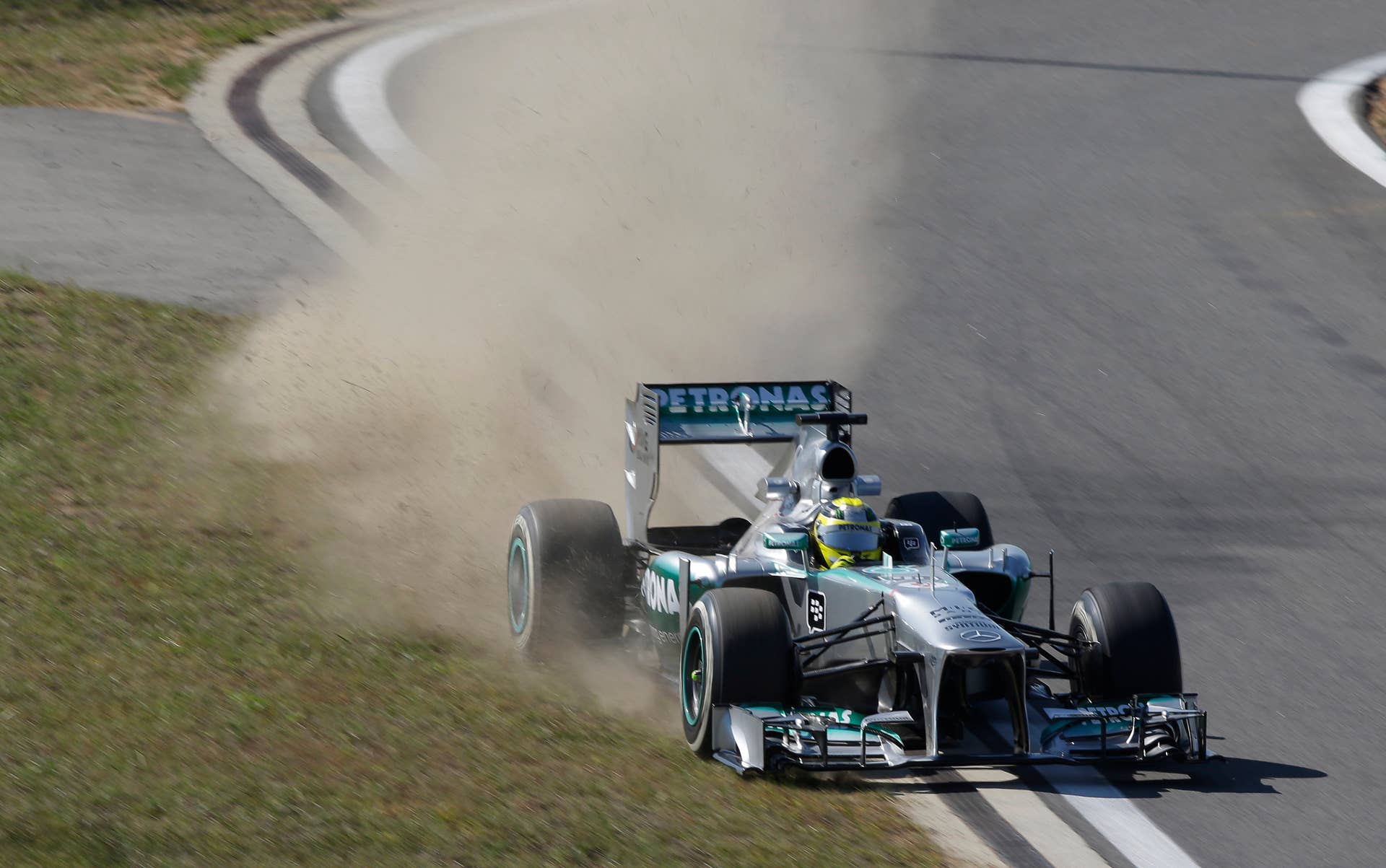 Mercedes driver Nico Rosberg of Germany goes off the circuit during the second practice session for the Korean Formula One Grand Prix at the Korean International Circuit in Yeongam, South Korea, Friday, Oct. 4, 2013. (AP Photo/Mark Baker)
