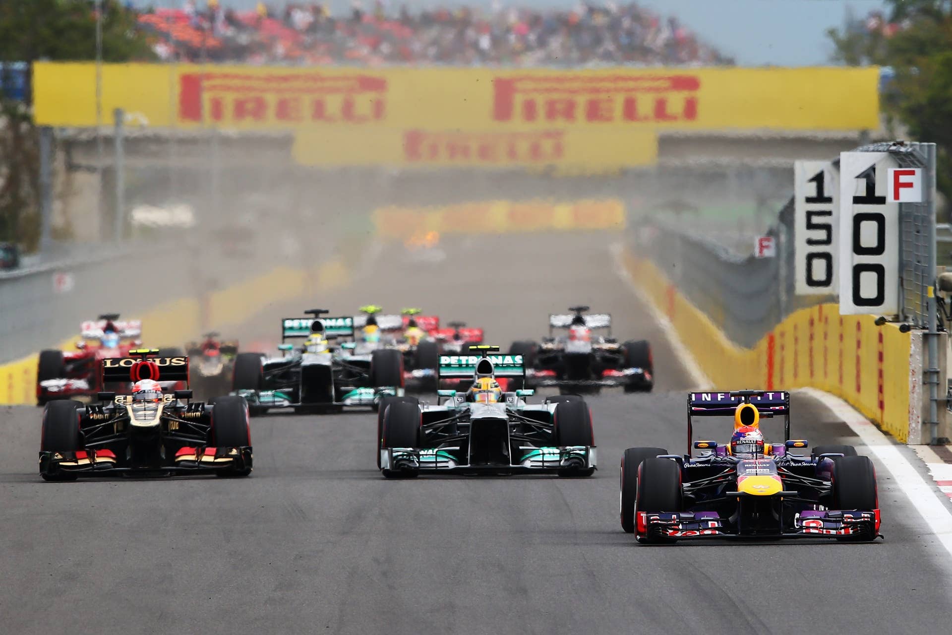 YEONGAM-GUN, SOUTH KOREA - OCTOBER 06:  Sebastian Vettel (R) of Germany and Infiniti Red Bull Racing leads the field on lap one of the Korean Formula One Grand Prix at Korea International Circuit on October 6, 2013 in Yeongam-gun, South Korea.  (Photo by Clive Mason/Getty Images)