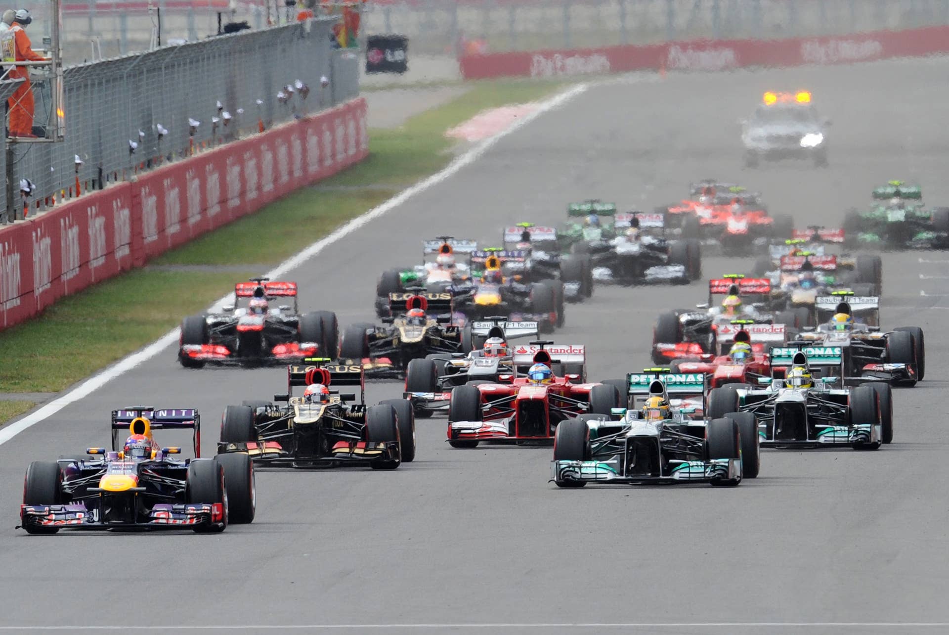 Red Bull driver Sebastian Vettel of Germany (bottom L) leads the pack at the start of the Formula One Korean Grand Prix in Yeongam on October 6, 2013.  AFP PHOTO/ Prakash SINGH        (Photo credit should read PRAKASH SINGH/AFP/Getty Images)