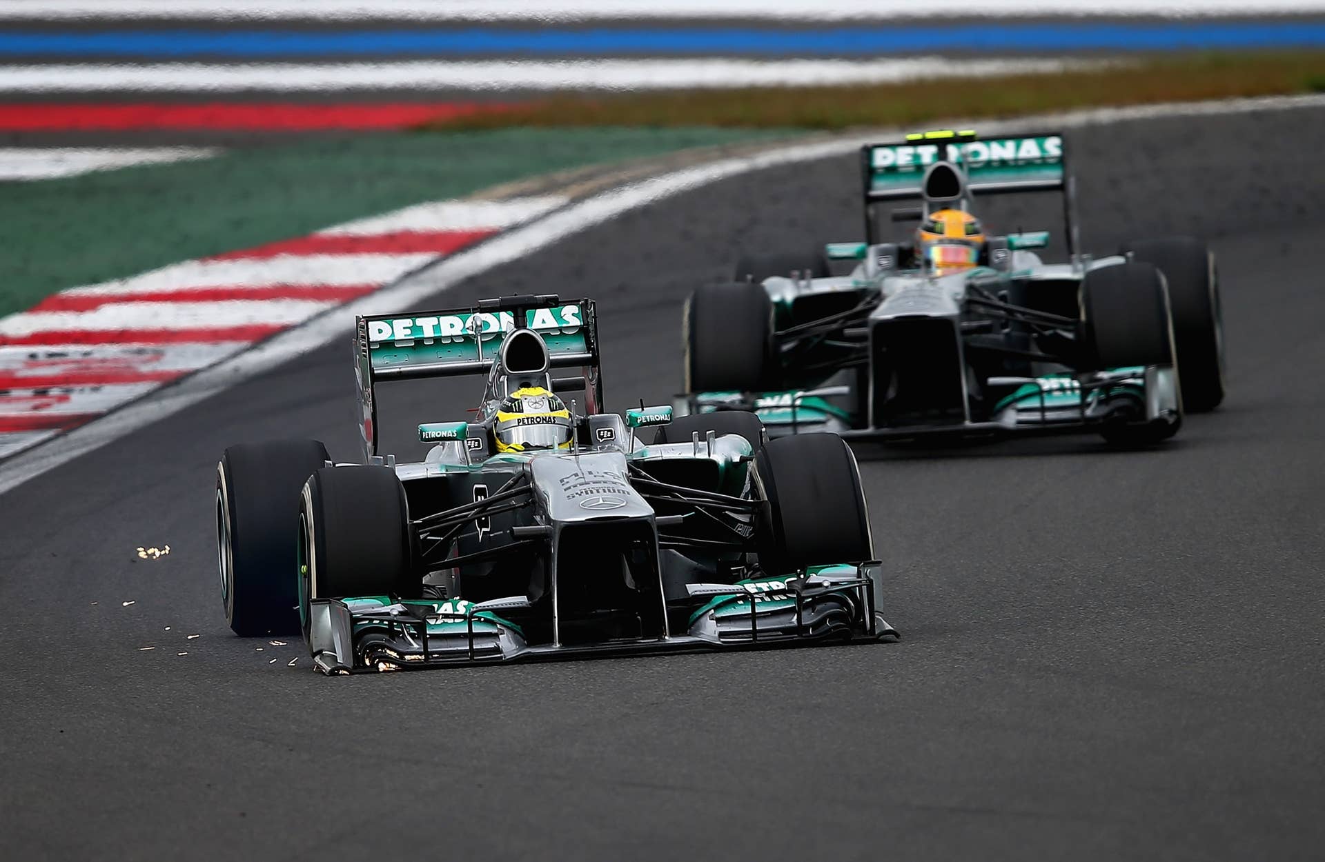YEONGAM-GUN, SOUTH KOREA - OCTOBER 06:  Nico Rosberg of Germany and Mercedes GP leads from team mate Lewis Hamilton of Great Britain and Mercedes GP during the Korean Formula One Grand Prix at Korea International Circuit on October 6, 2013 in Yeongam-gun, South Korea.  (Photo by Clive Mason/Getty Images)