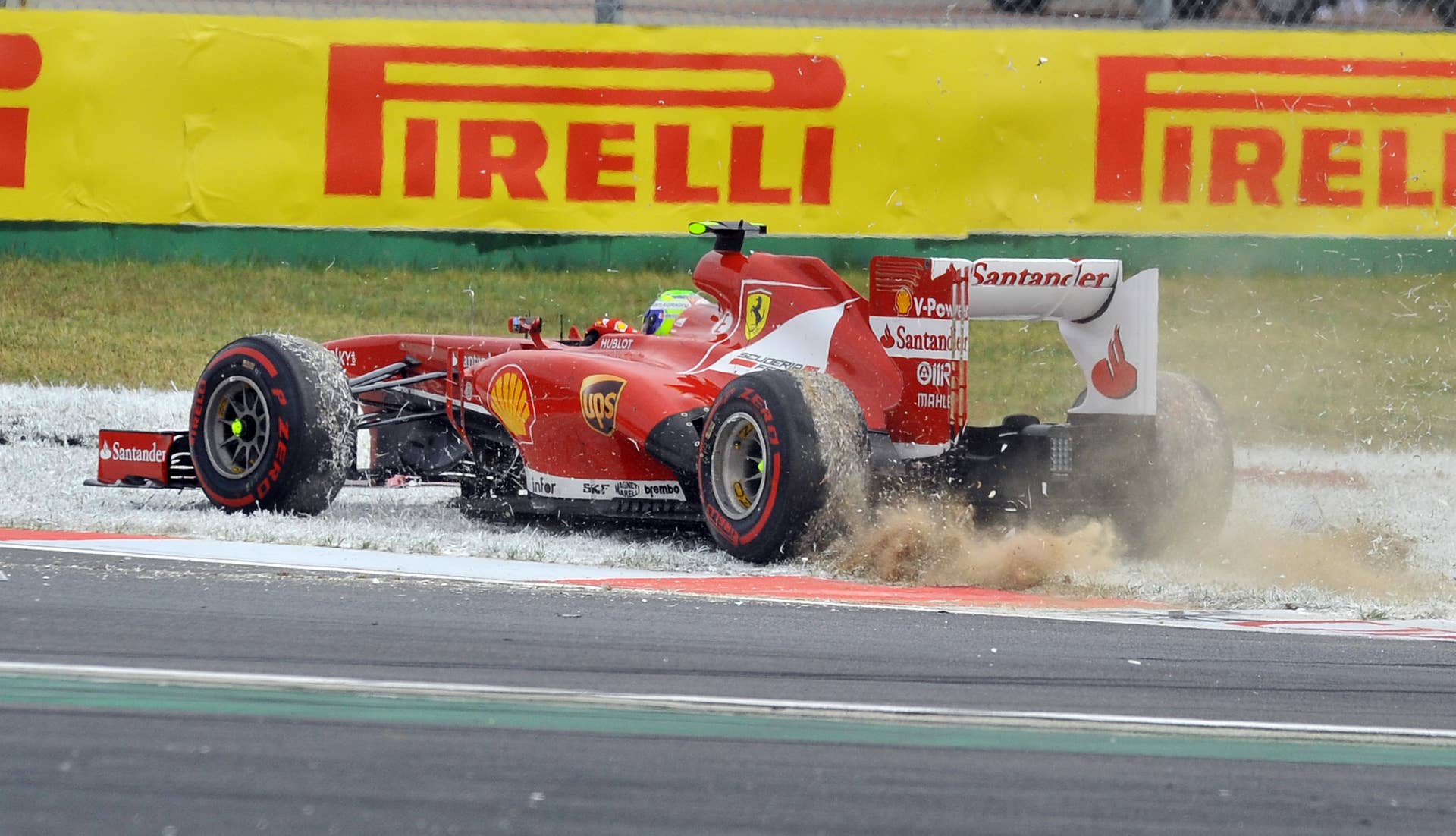 Ferrari driver Felipe Massa of Brazil spins during the Formula One Korean Grand Prix in Yeongam on October 6, 2013.  AFP PHOTO / JUNG YEON-JE        (Photo credit should read JUNG YEON-JE/AFP/Getty Images)