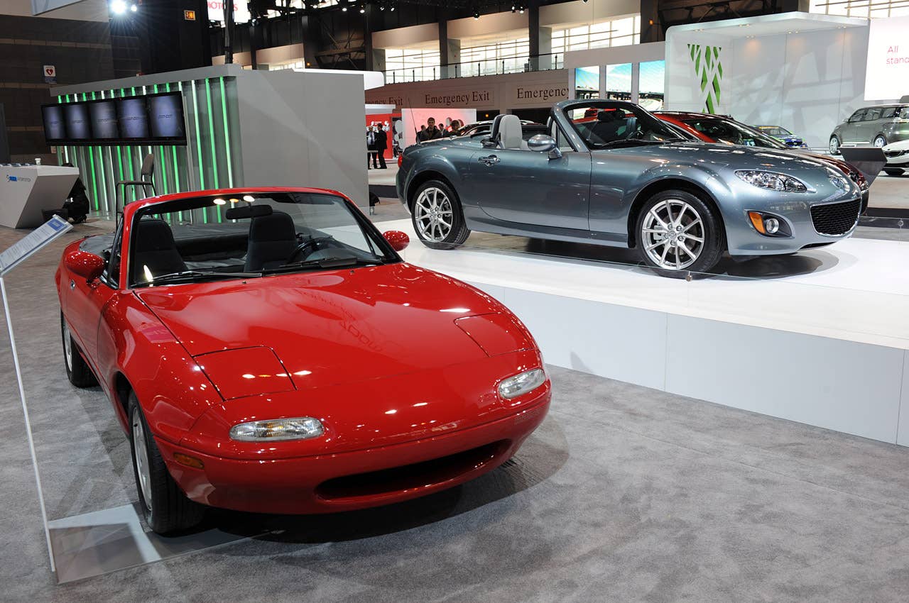 2011 Mazda MX-5 Miata Special Edition and an NA Miata