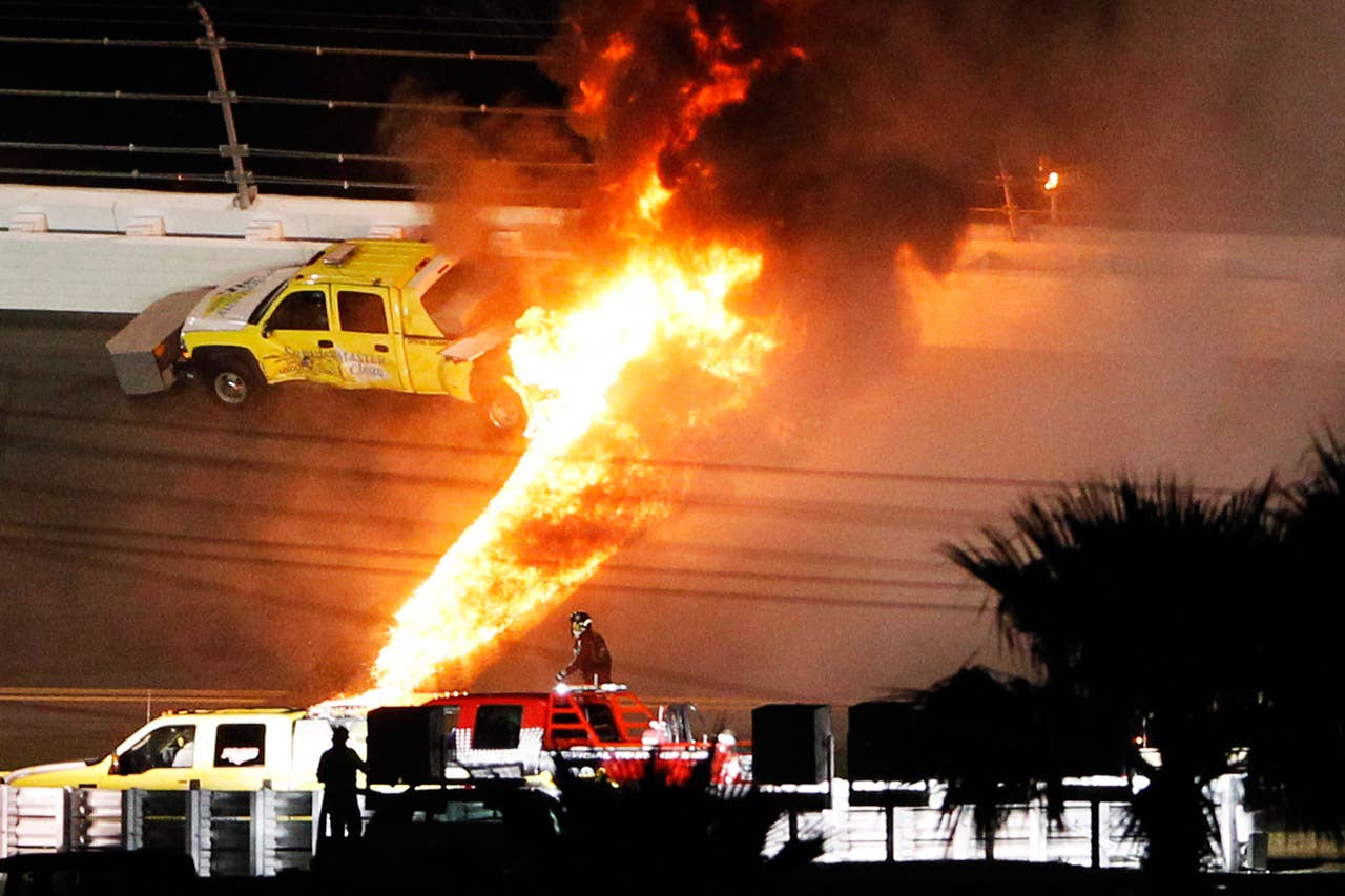 DAYTONA BEACH, FL - FEBRUARY 27:  A jet dryer bursts into flames after being hit by Juan Pablo Montoya, driver of the #42 Target Chevrolet, under caution during the NASCAR Sprint Cup Series Daytona 500 at Daytona International Speedway on February 27, 2012 in Daytona Beach, Florida.  (Photo by Streeter Lecka/Getty Images)