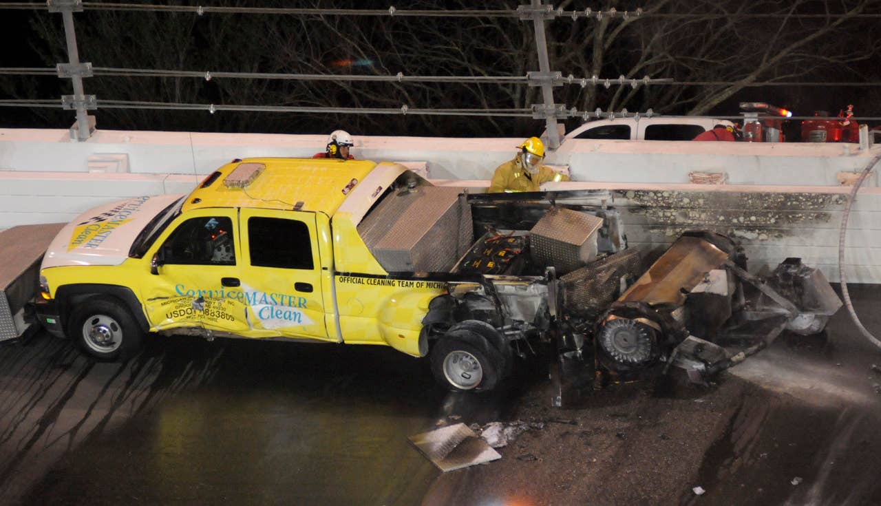 A jet dryer sits on the track after a fire burned the back of the truck during the NASCAR Daytona 500 auto race at Daytona International Speedway in Daytona Beach, Fla., Monday, Feb. 27, 2012. (AP Photo/Zack Hughes)