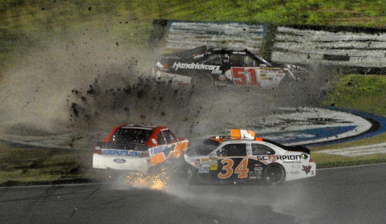 David Ragan (34), Trevor Bayne, left, and Kurt Busch (51) are involved in a wreck during the NASCAR Daytona 500 auto race at Daytona International Speedway in Daytona Beach, Fla., Monday, Feb. 27, 2012. (AP Photo/Phelan M. Ebenhack)