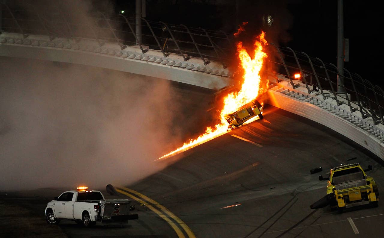 DAYTONA BEACH, FL - FEBRUARY 27:  A jet dryer bursts into flames after being hit by Juan Pablo Montoya, driver of the #42 Target Chevrolet, under caution during the NASCAR Sprint Cup Series Daytona 500 at Daytona International Speedway on February 27, 2012 in Daytona Beach, Florida.  (Photo by Jonathan Ferrey/Getty Images for NASCAR)