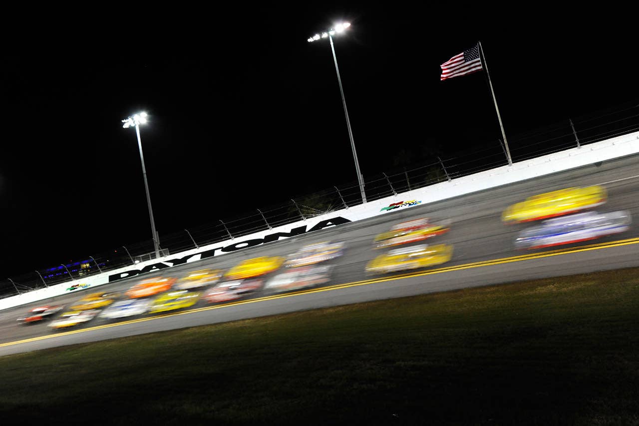 DAYTONA BEACH, FL - FEBRUARY 27:  Cars race during the NASCAR Sprint Cup Series Daytona 500 at Daytona International Speedway on February 27, 2012 in Daytona Beach, Florida.  (Photo by John Harrelson/Getty Images for NASCAR)